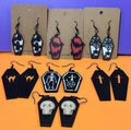 Eight pairs of 3D printed coffin earrings: ghost, bat, spiderweb, cat, skeleton, cross, skull designs
