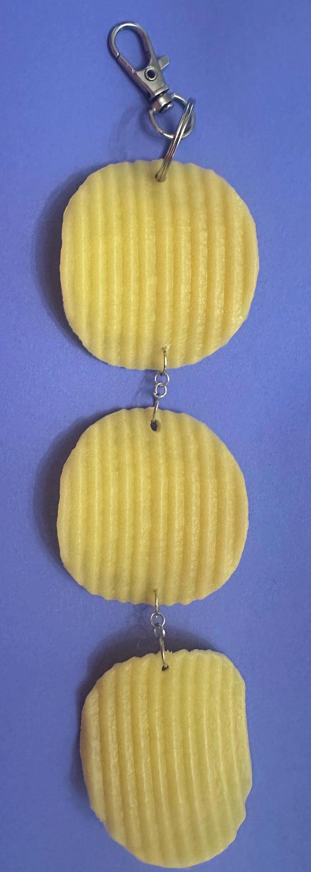 Potato chip keychain with three ruffled chips on silver lobster clasp